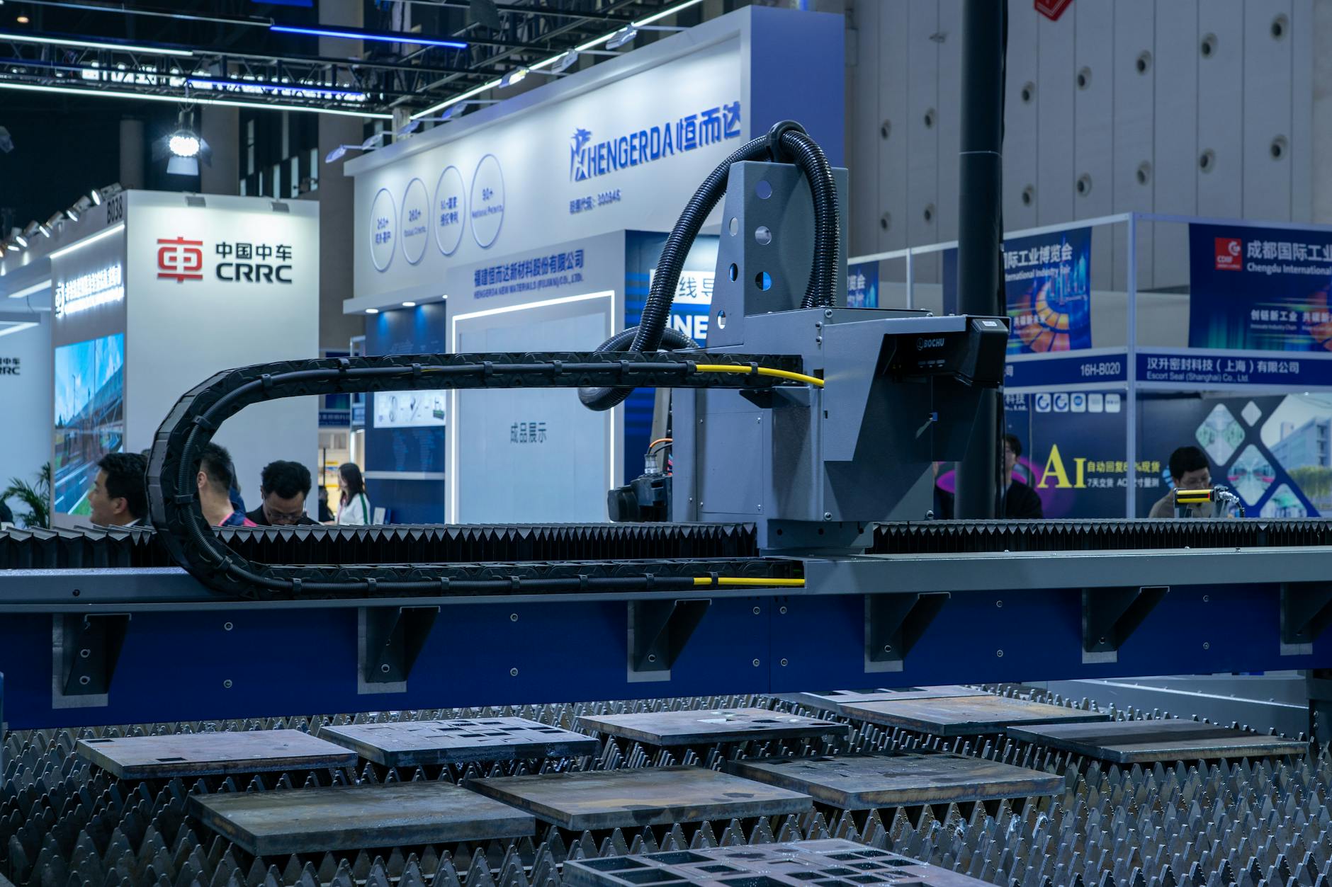 A self-running PowerPoint slide show playing on a large screen at a trade show booth
