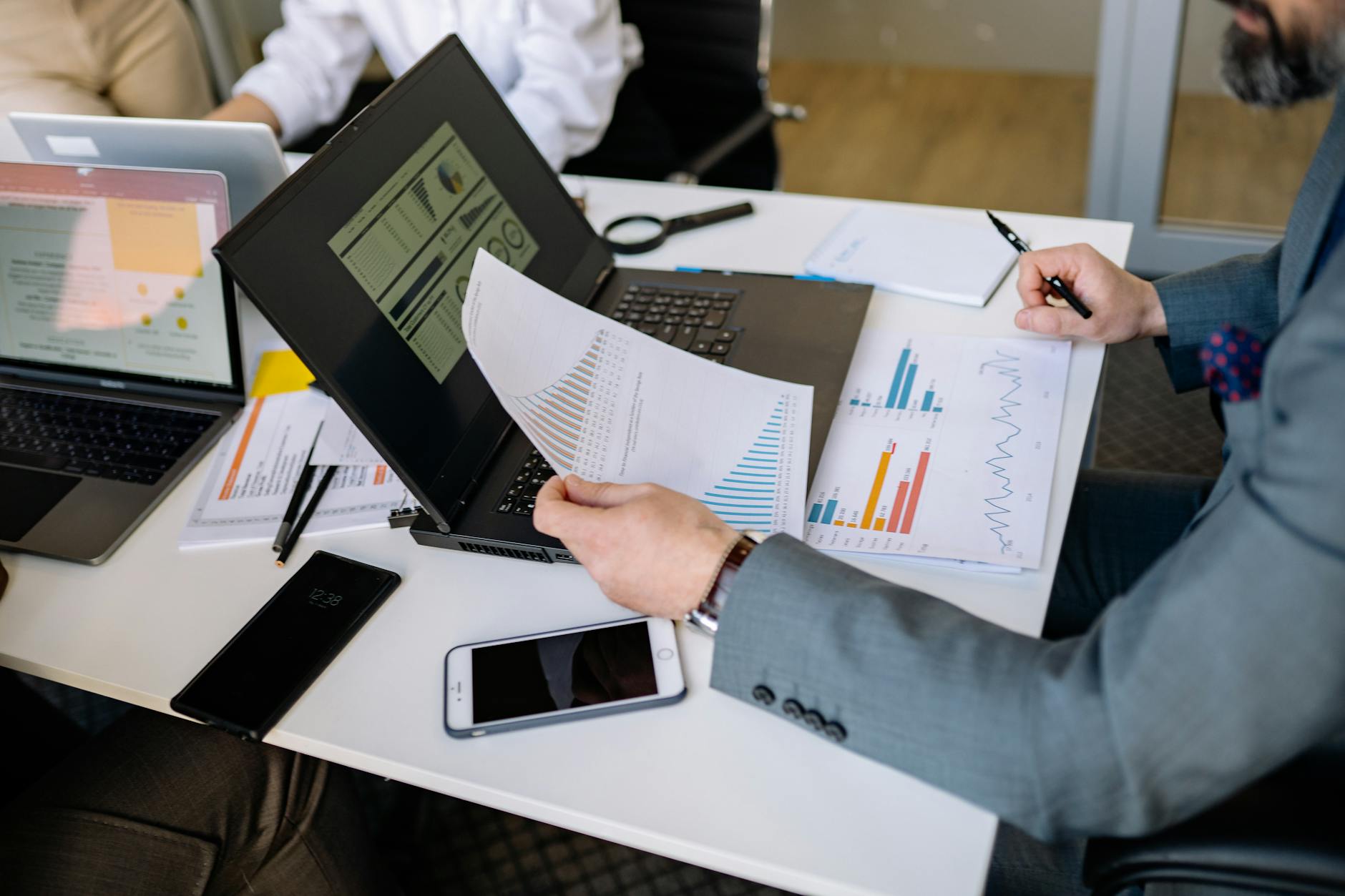Project manager building an Excel Gantt chart timeline on a laptop
