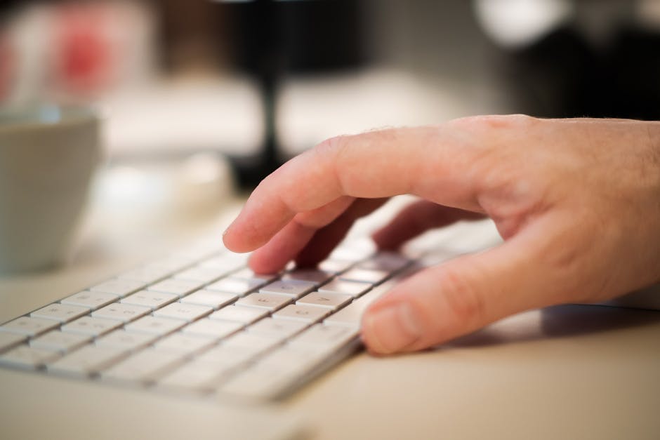 Fingers on a keyboard typing a shortcut