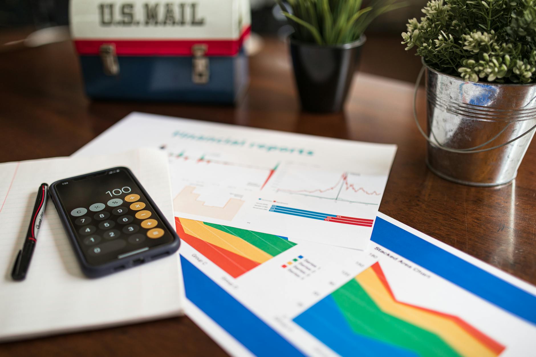Calculator and printed financial report on a desk