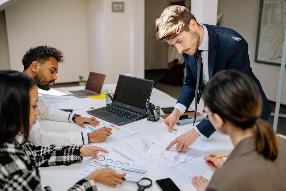 Finance team reviewing reports in a Singapore office