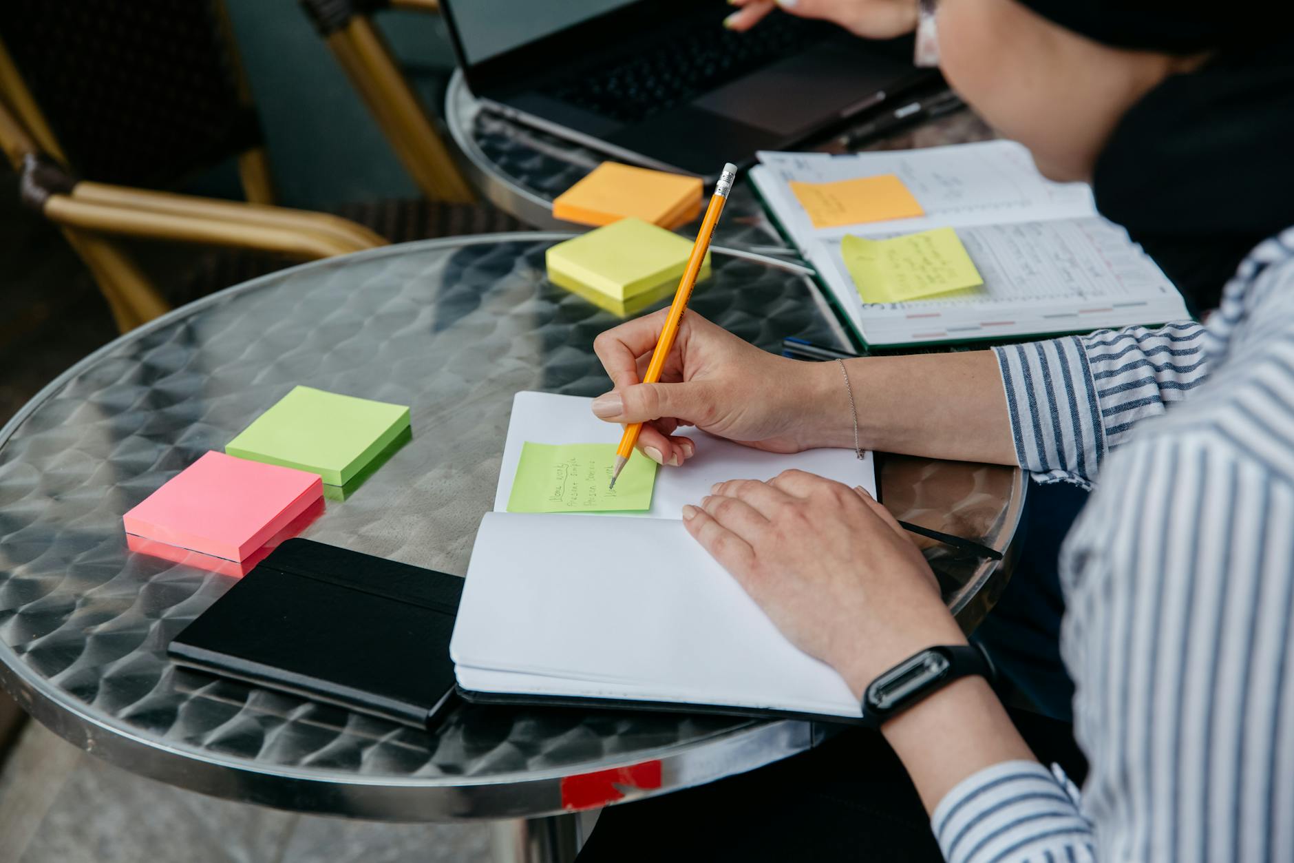 Planning Copilot presentation prompts with sticky notes and a notebook on a desk