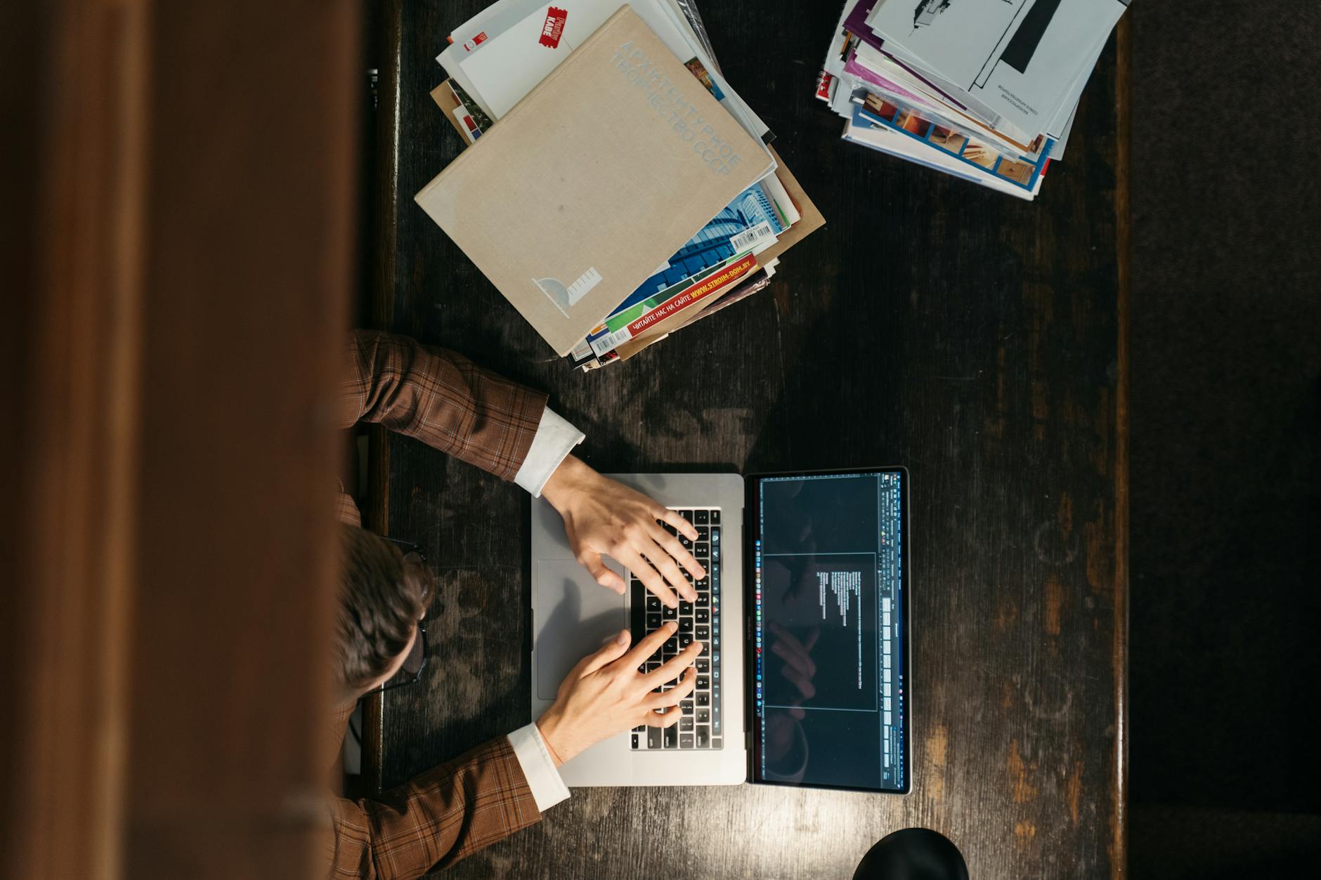 Editing speaker notes in PowerPoint Notes Page view on a wooden desk