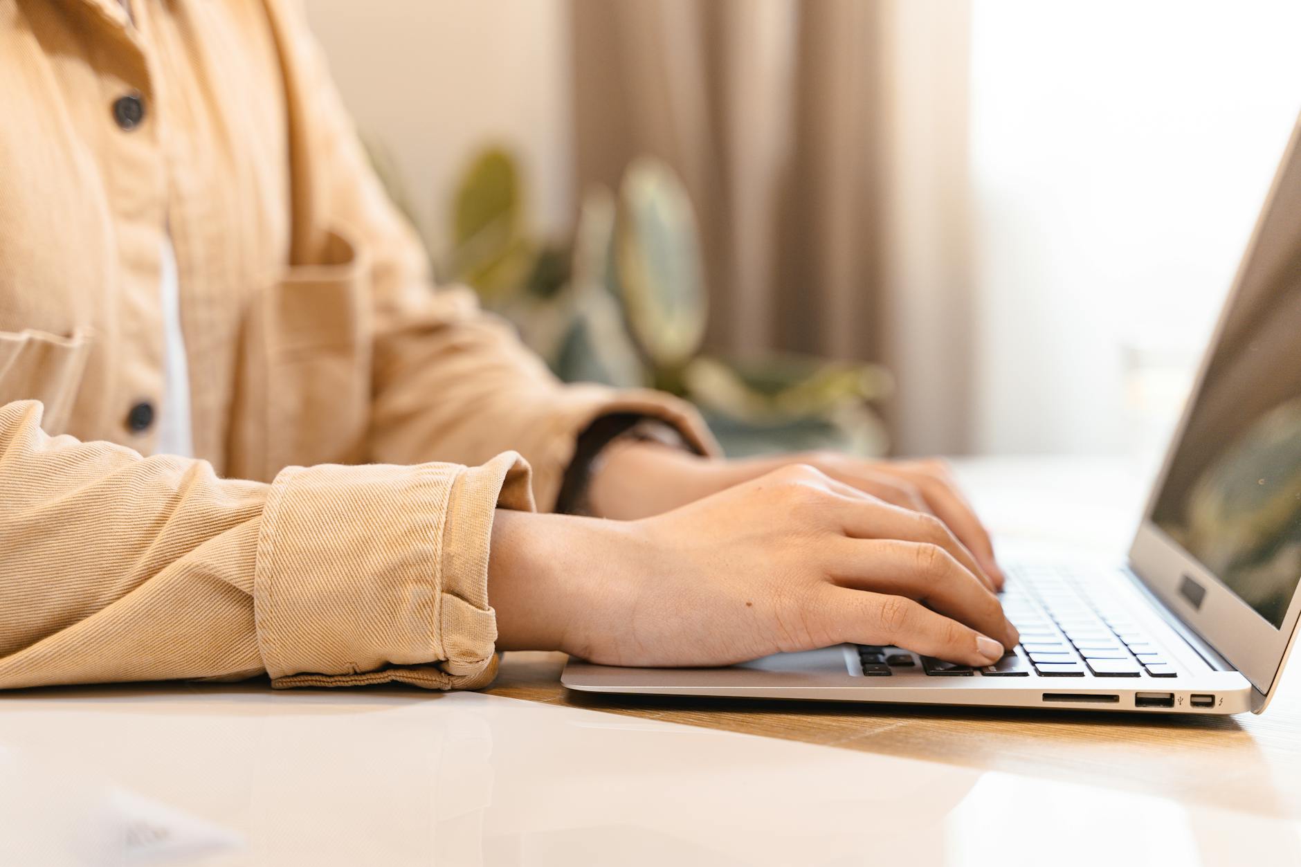Adding speaker notes in the PowerPoint Notes pane below a slide on a laptop