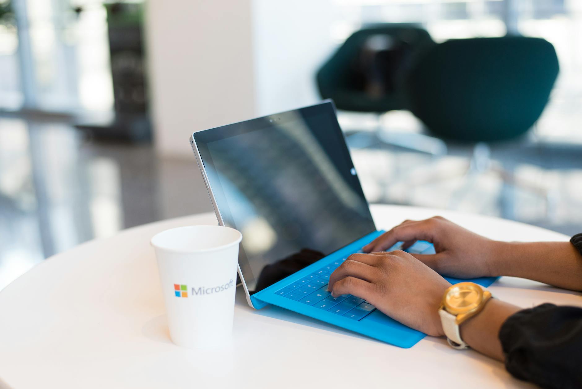Office worker signing in to Microsoft account on a Windows laptop