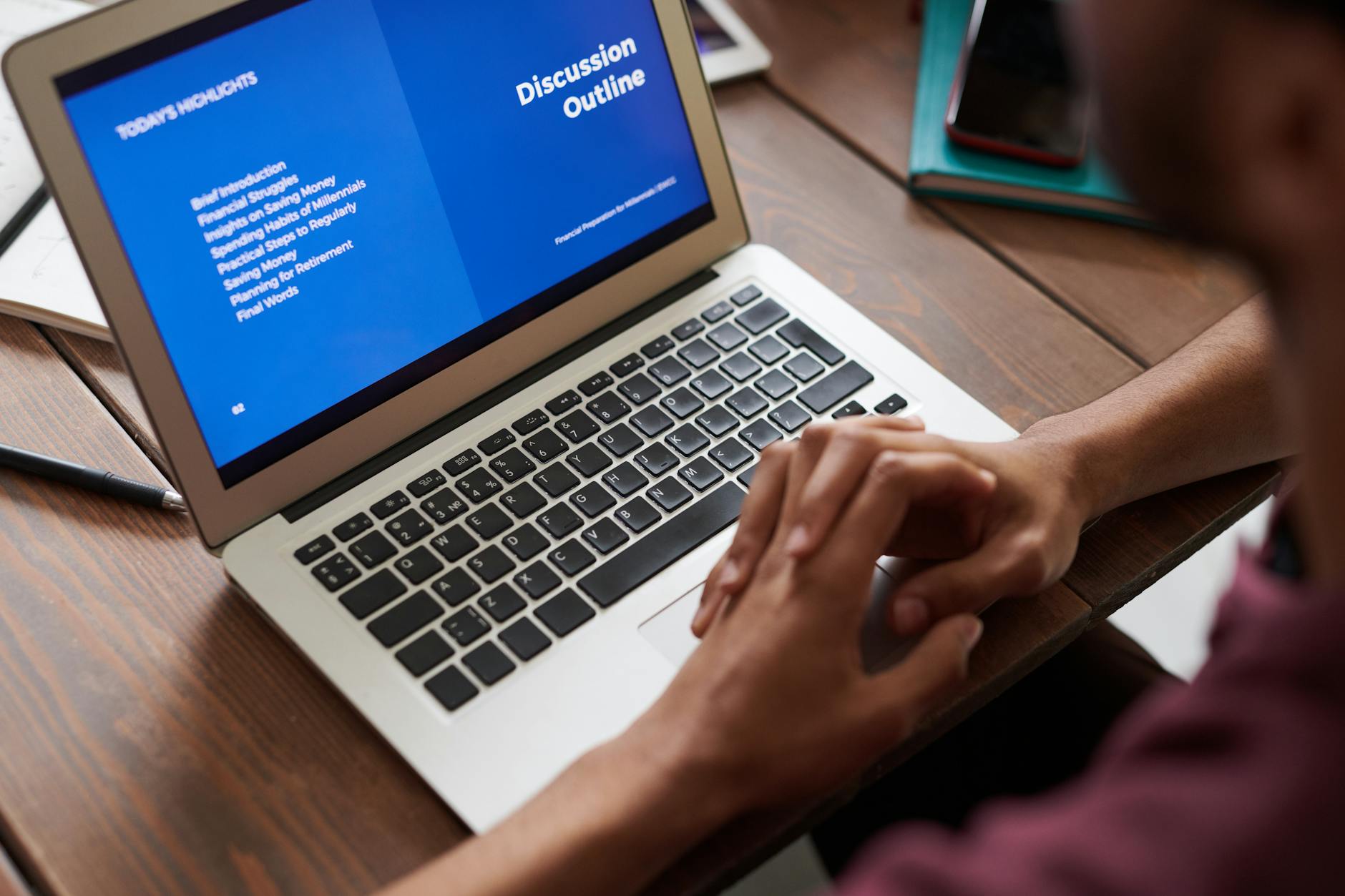 A laptop on a desk with PowerPoint open, ready to start a new presentation